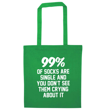 99% of socks are single and you don't see them crying about it green tote bag