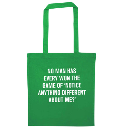 No man has ever won the game of 'notice anything different about me?' green tote bag