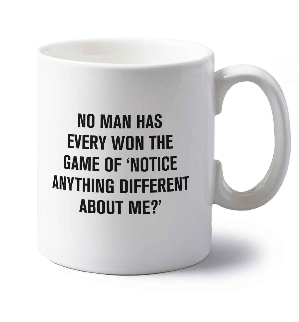 No man has ever won the game of 'notice anything different about me?' left handed white ceramic mug 