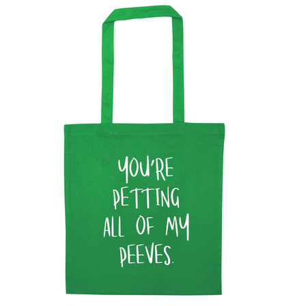 You're petting all of my peeves green tote bag