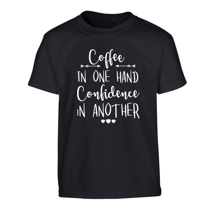 Coffee in one hand confidence in the other Children's black Tshirt 12-13 Years