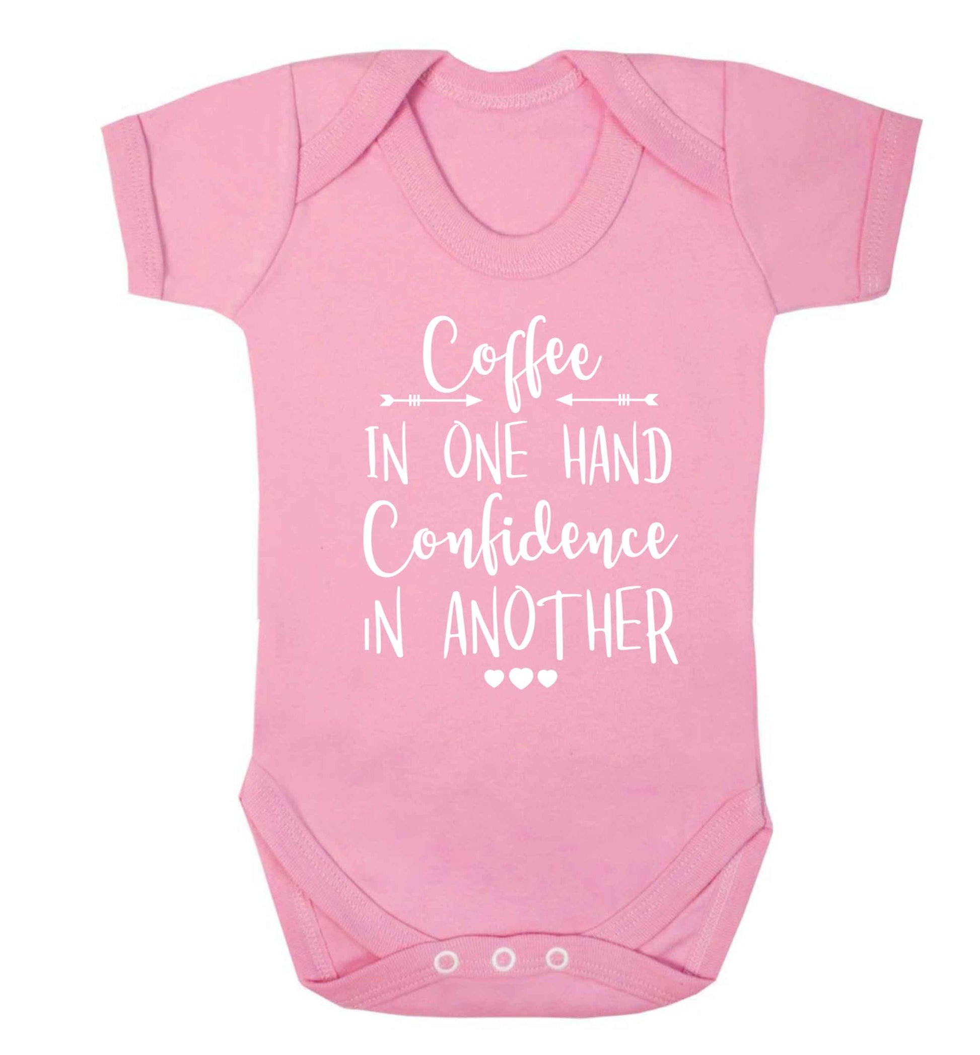 Coffee in one hand confidence in the other Baby Vest pale pink 18-24 months