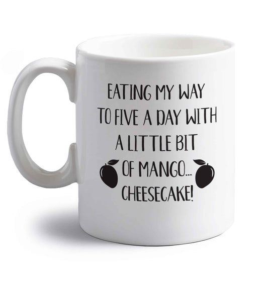 Eating my way to five a day with a little bit of mango cheesecake right handed white ceramic mug 