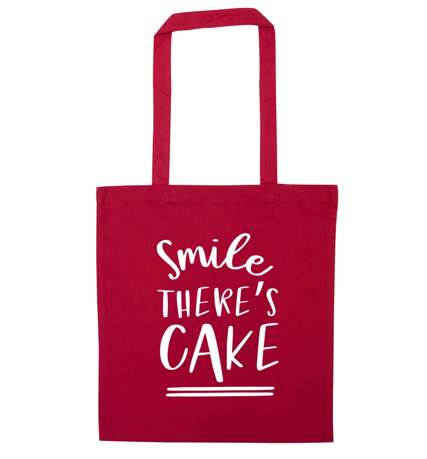 Smile there's cake red tote bag