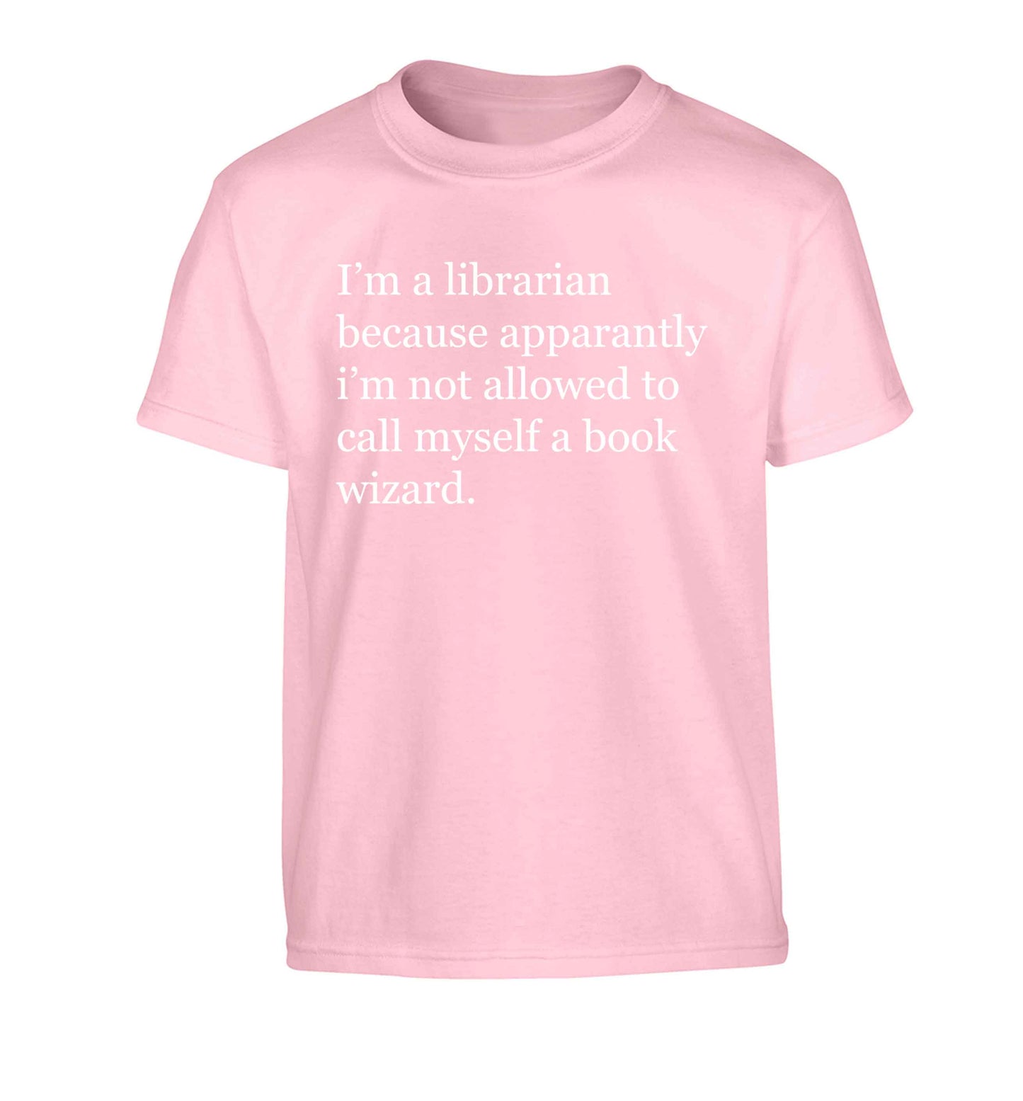i√ïm a librarian because apparantly i√ïm not allowed to call myself a book wizard Children's light pink Tshirt 12-13 Years