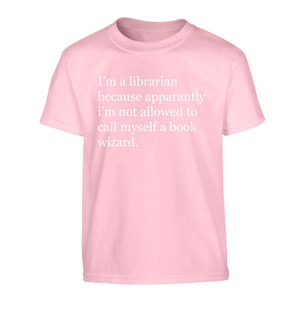 i√ïm a librarian because apparantly i√ïm not allowed to call myself a book wizard Children's light pink Tshirt 12-13 Years