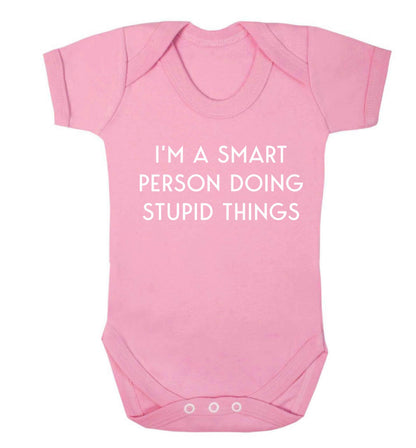 I'm a smart person doing stupid things Baby Vest pale pink 18-24 months