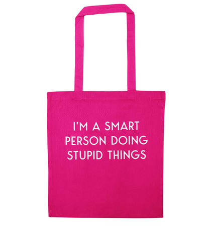 I'm a smart person doing stupid things pink tote bag
