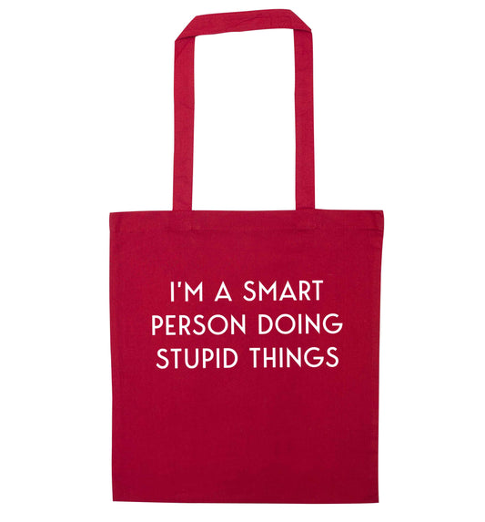 I'm a smart person doing stupid things red tote bag