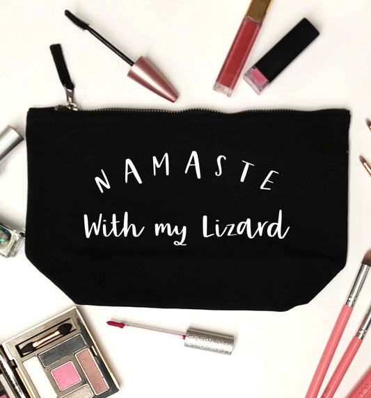 Namaste with my lizard black makeup bag