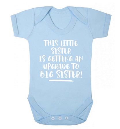This little sister is getting an upgrade to big sister! Baby Vest pale blue 18-24 months
