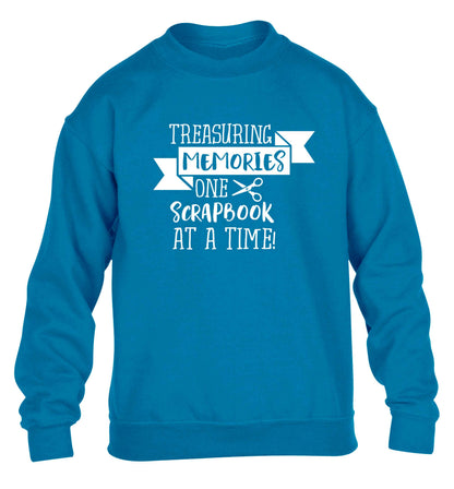 Treasuring memories one scrapbook at a time children's blue sweater 12-13 Years