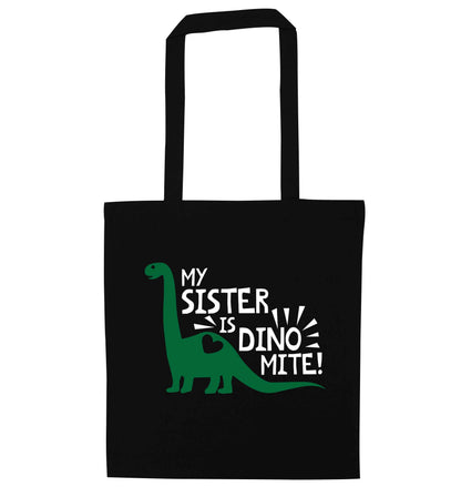 My sister is dinomite! black tote bag