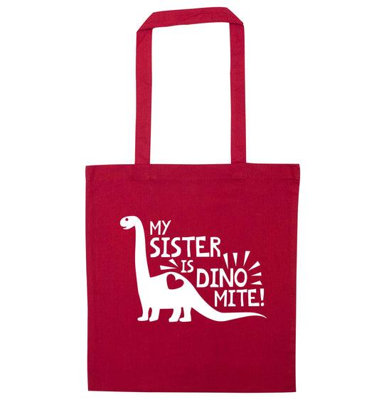 My sister is dinomite! red tote bag