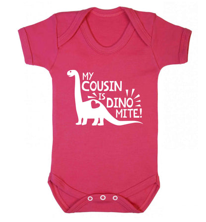 My cousin is dinomite! Baby Vest dark pink 18-24 months