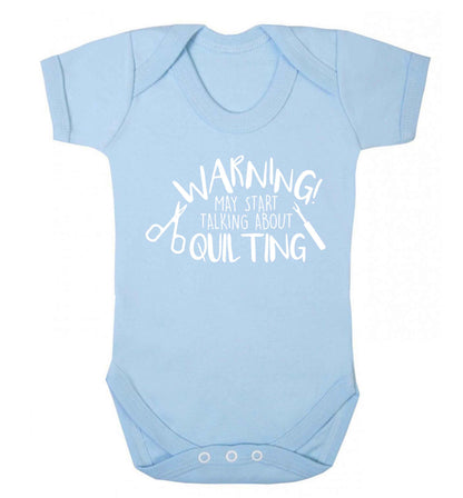 Warning may start talking about quilting Baby Vest pale blue 18-24 months