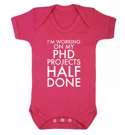I'm working on my PHD projects half done Baby Vest dark pink 18-24 months