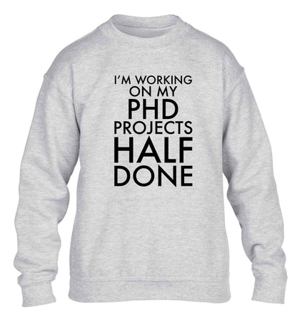 I'm working on my PHD projects half done children's grey sweater 12-13 Years