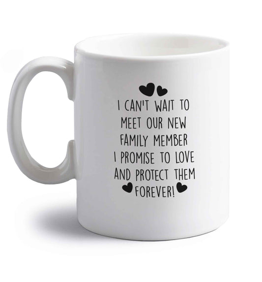 I can't wait to meet our new family member I promise to love and protect them foreverright handed white ceramic mug 