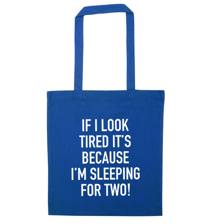 If I look tired it's because I'm sleeping for two blue tote bag