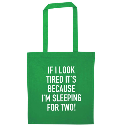 If I look tired it's because I'm sleeping for two green tote bag
