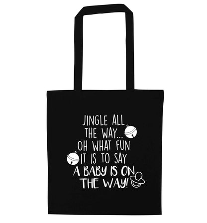 Oh what fun it is to say a baby is on the way! black tote bag