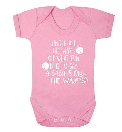 Oh what fun it is to say a baby is on the way! Baby Vest pale pink 18-24 months