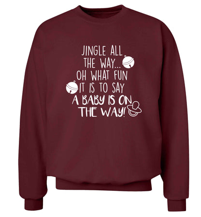 Oh what fun it is to say a baby is on the way! Adult's unisex maroon Sweater 2XL