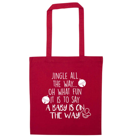 Oh what fun it is to say a baby is on the way! red tote bag