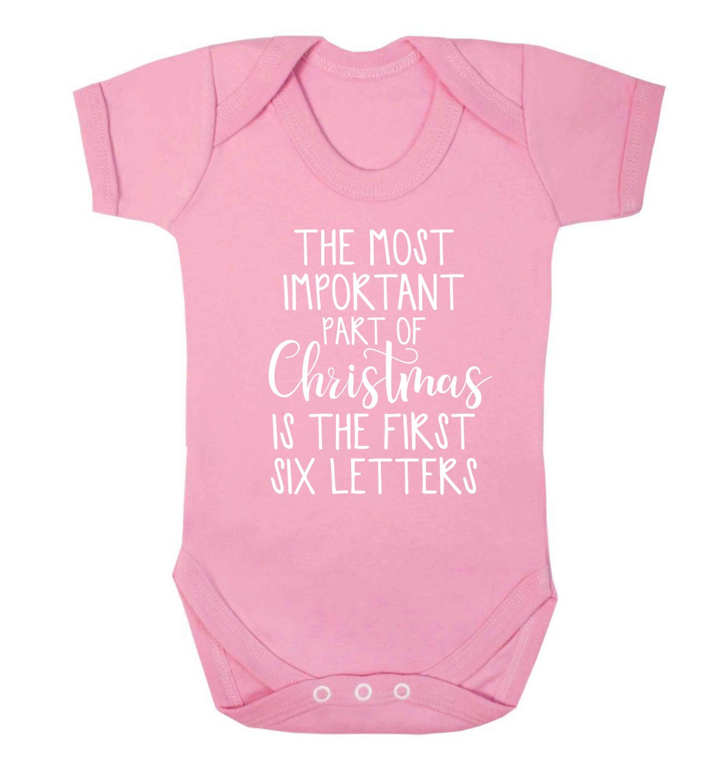 The most important thing about Christmas is the first six letters Baby Vest pale pink 18-24 months