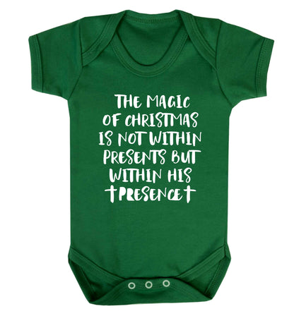 The magic of Christmas is not within presents but within his presence Baby Vest green 18-24 months