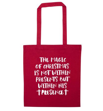 The magic of Christmas is not within presents but within his presence red tote bag