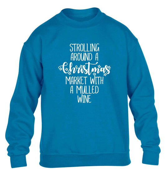 Strolling around a Christmas market with mulled wine children's blue sweater 12-13 Years