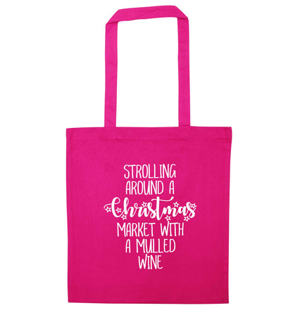 Strolling around a Christmas market with mulled wine pink tote bag