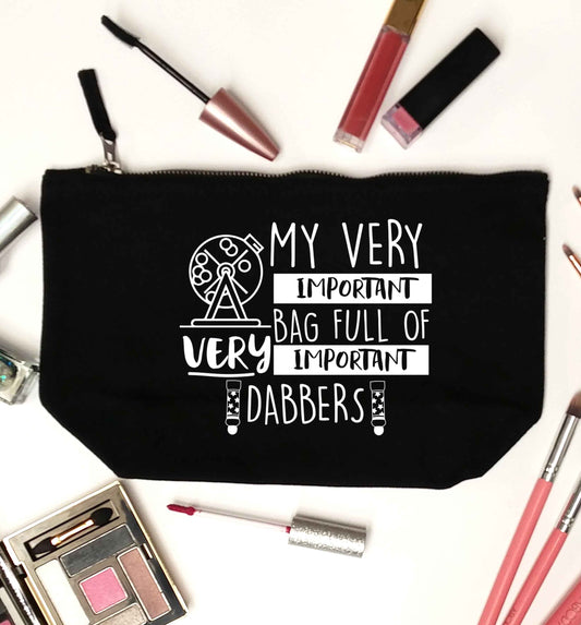 My very important bag full of very important dabbers black makeup bag