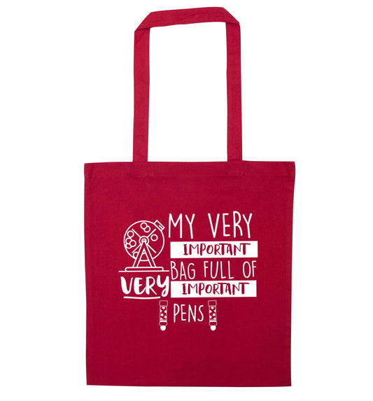 My very important bag full of very important pens red tote bag