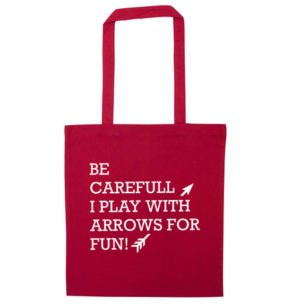 Be carefull I play with arrows for fun red tote bag