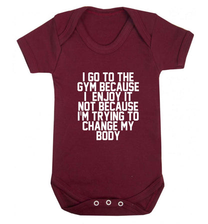 I go to the gym because I enjoy it not because I'm trying to change my body baby vest maroon 18-24 months
