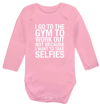 I go to the gym to workout not to take selfies baby vest long sleeved pale pink 6-12 months