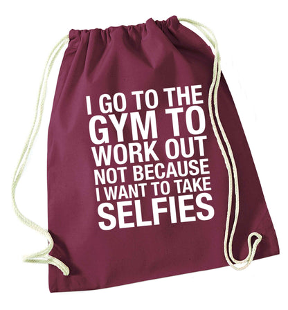 I go to the gym to workout not to take selfies maroon drawstring bag