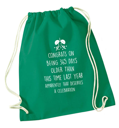 Congrats on being 365 days older than you were this time last year apparently that deserves a celebration green drawstring bag