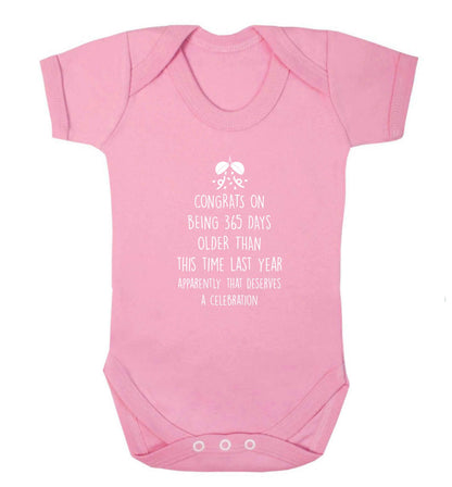 Congrats on being 365 days older than you were this time last year apparently that deserves a celebration baby vest pale pink 18-24 months