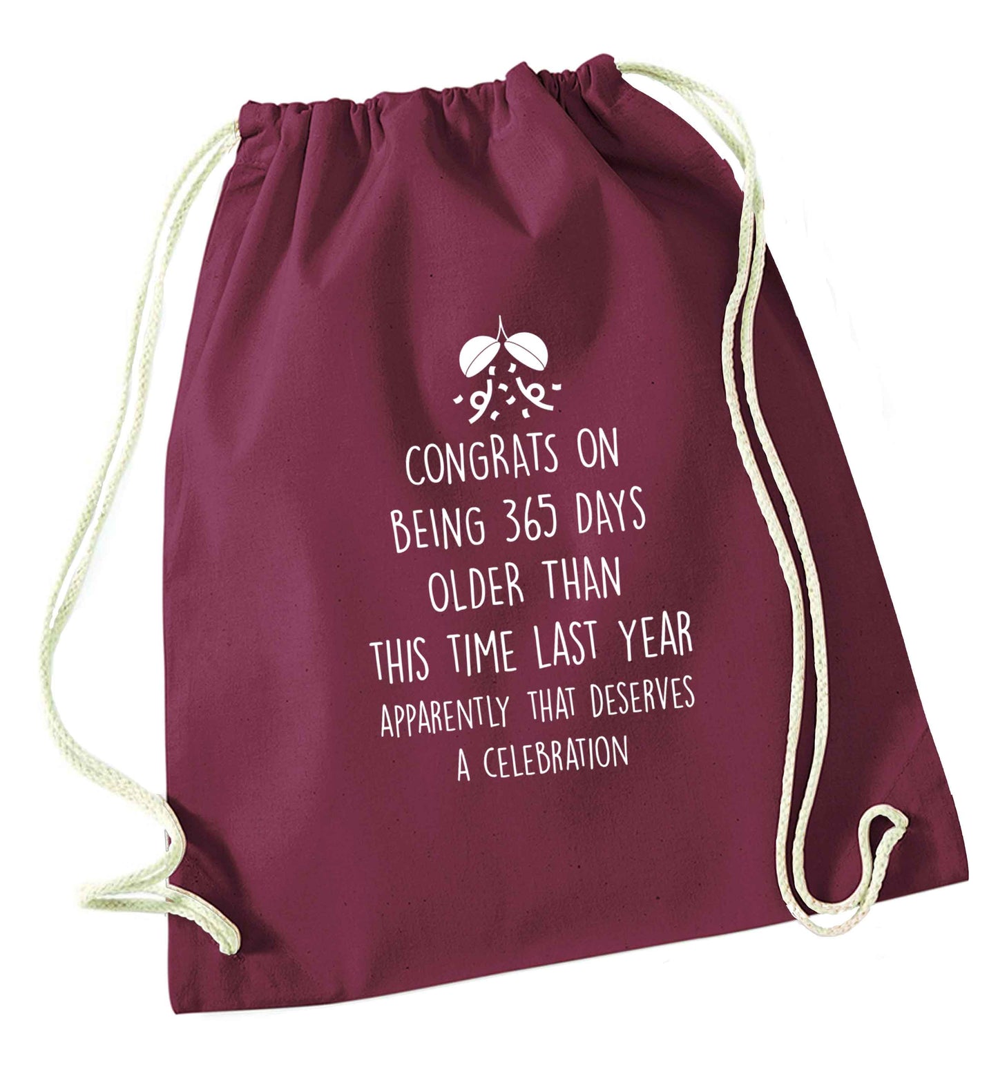 Congrats on being 365 days older than you were this time last year apparently that deserves a celebration maroon drawstring bag
