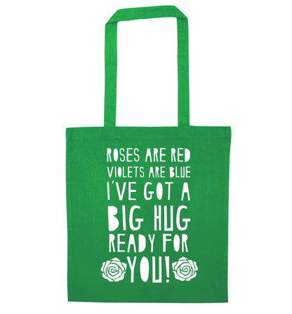 Roses are red violets are blue I've got a big hug coming for you green tote bag