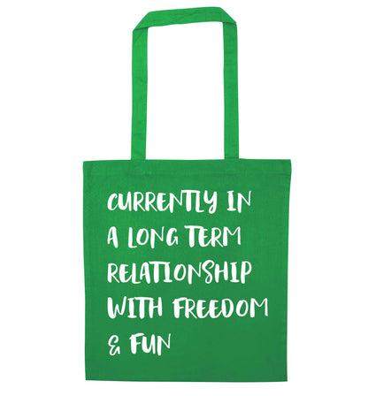 Currently in a long term relationship with freedom and fun green tote bag