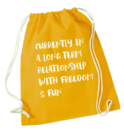 Currently in a long term relationship with freedom and fun mustard drawstring bag
