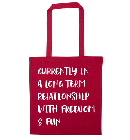 Currently in a long term relationship with freedom and fun red tote bag