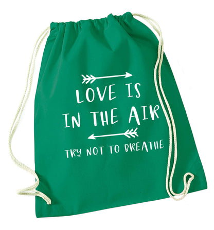 Love is in the air try not to breathe green drawstring bag