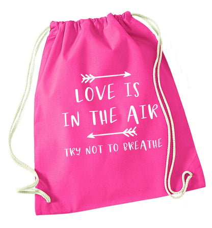 Love is in the air try not to breathe pink drawstring bag