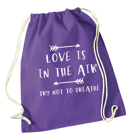 Love is in the air try not to breathe purple drawstring bag